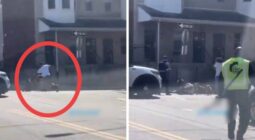شاهد 4 كلاب تحاول افتراس رجل وسط شارع عام.. وهكذا تدخل شرطي أمريكي